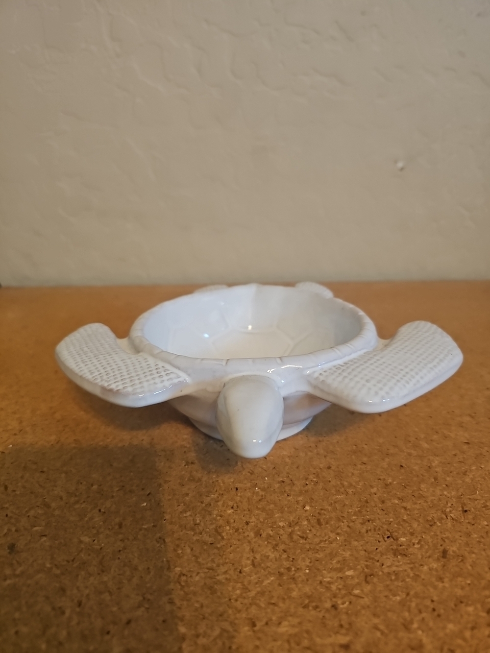 turtle dipping cup is a white ceramic bowl shaped like a sea turtle